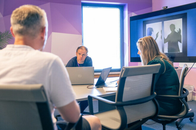 3 people in a meeting